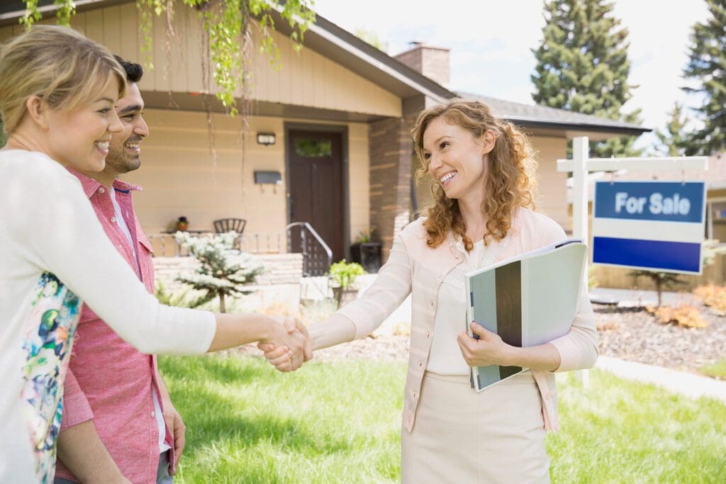 realtor and couple close on a home purchase in the Black Hills